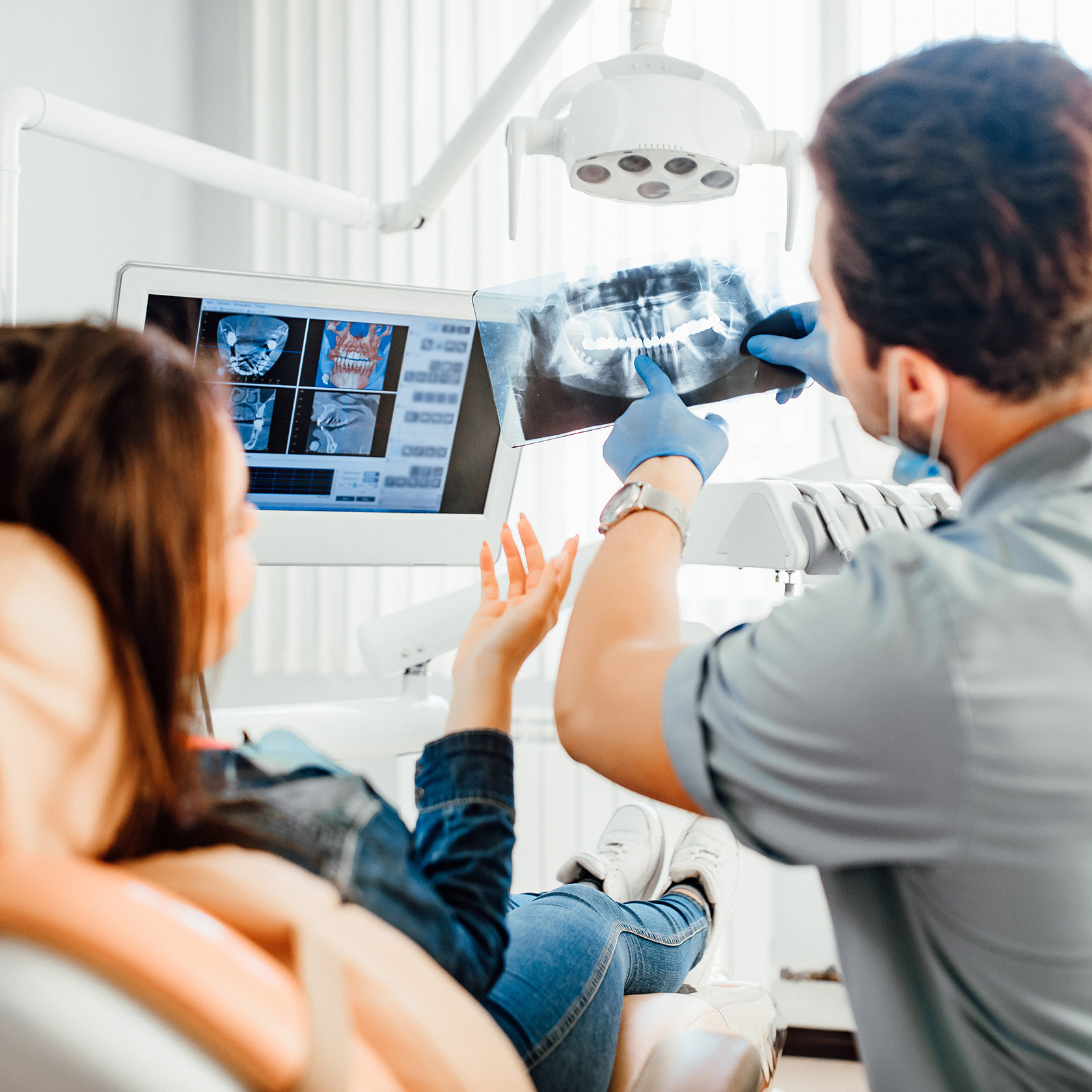 Dentist explaining dental x-ray results to the patient